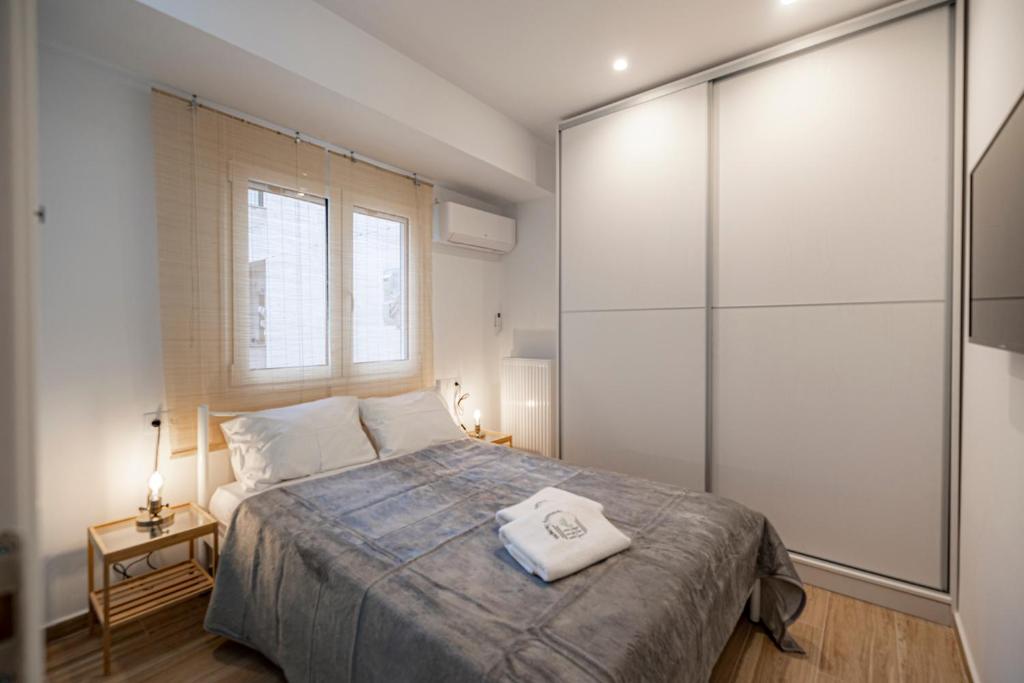 Posteľ alebo postele v izbe v ubytovaní Calliope Apartment