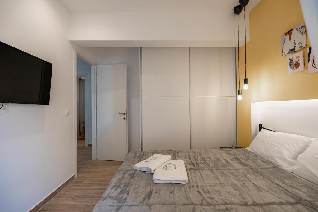 Posteľ alebo postele v izbe v ubytovaní Calliope Apartment