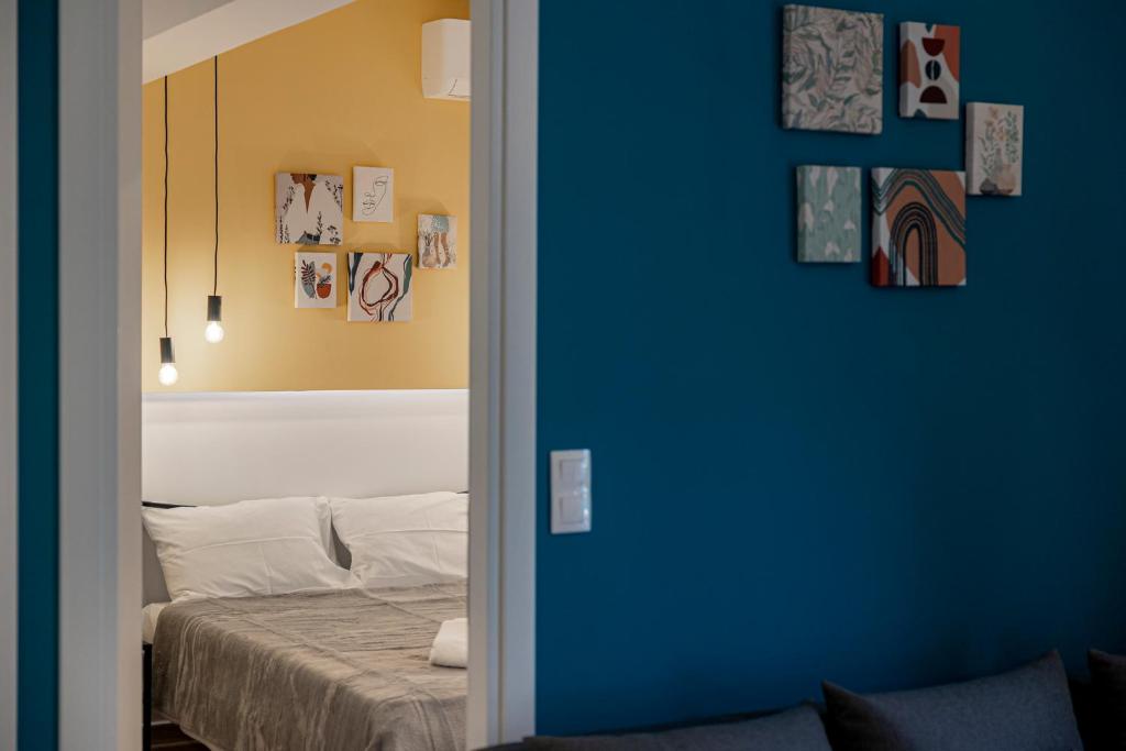 Posteľ alebo postele v izbe v ubytovaní Calliope Apartment