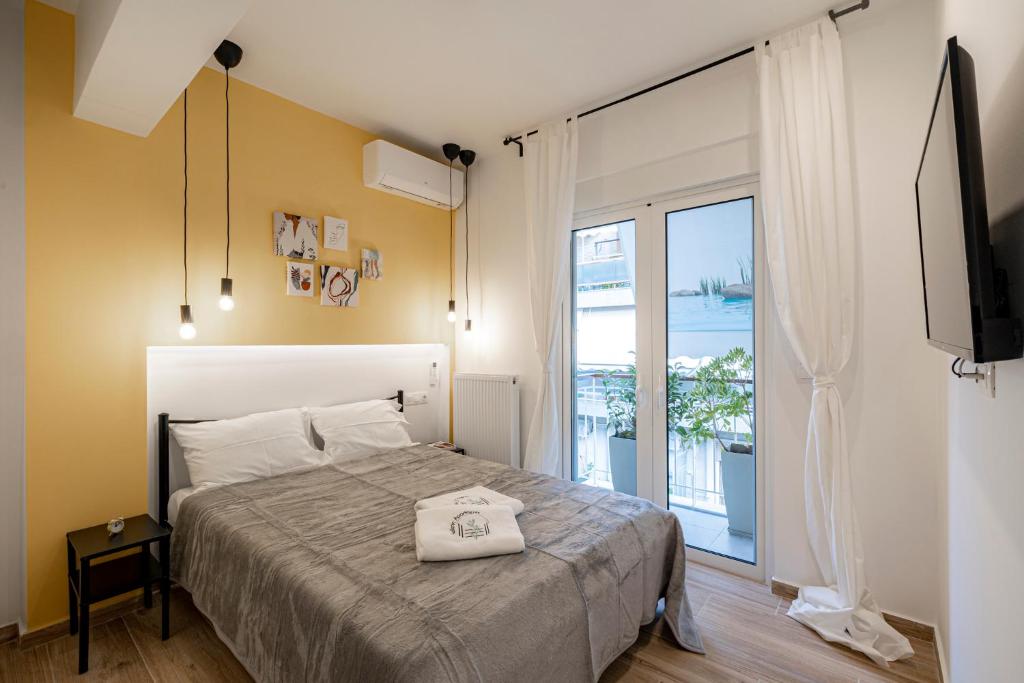 Posteľ alebo postele v izbe v ubytovaní Calliope Apartment