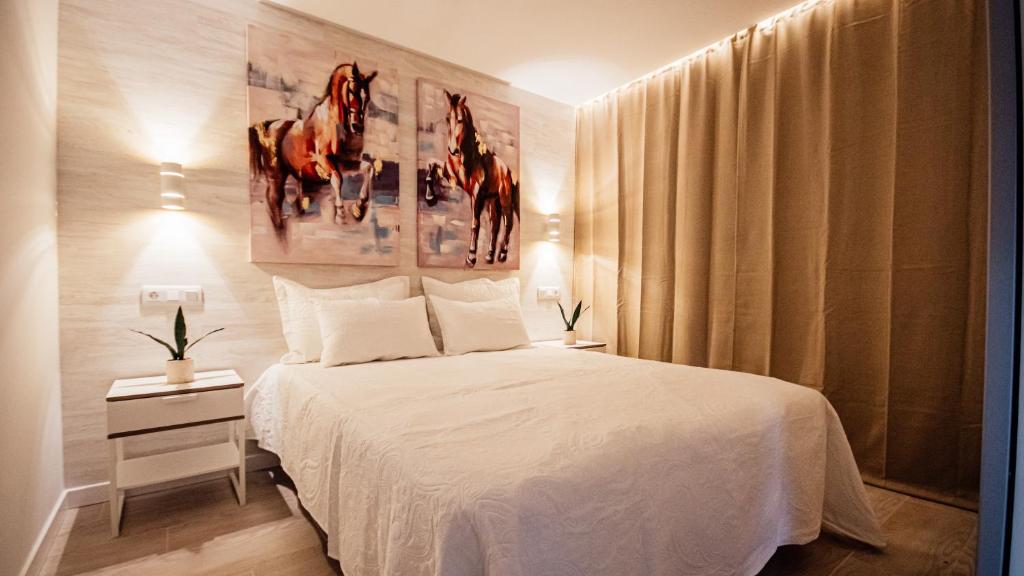 Posteľ alebo postele v izbe v ubytovaní Don Quijote Apartment