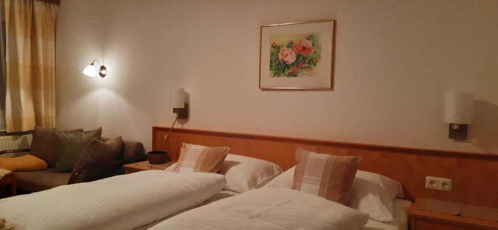 Postel nebo postele na pokoji v ubytování Pension und Appartement Weinschreiber