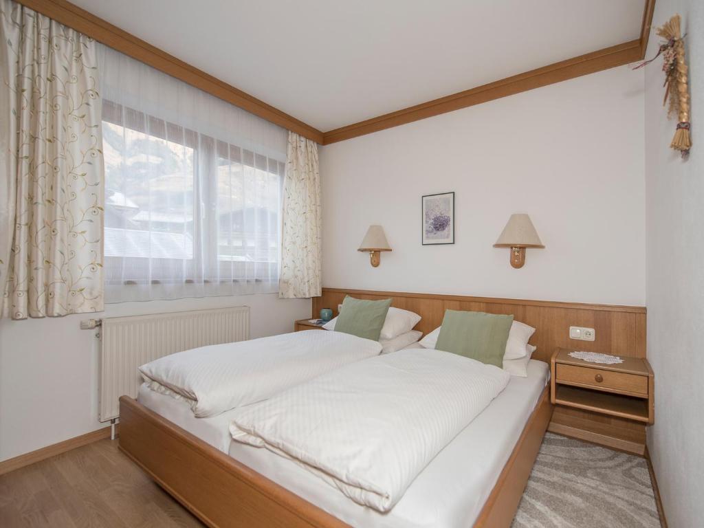 Postel nebo postele na pokoji v ubytování Pension und Appartement Weinschreiber
