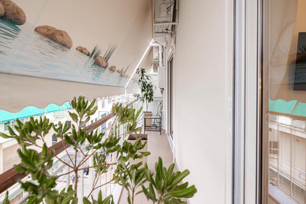 Televízia a/alebo spoločenská miestnosť v ubytovaní Calliope Apartment