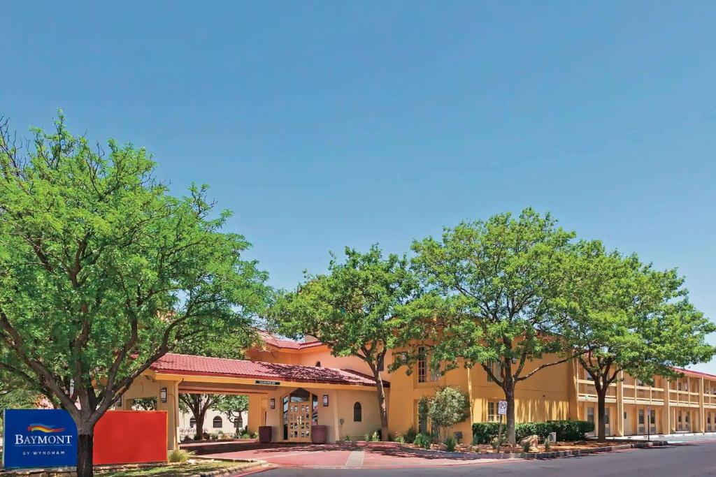 a rendering of the front of a hotel at Baymont by Wyndham Lubbock - Downtown Civic Center in Lubbock