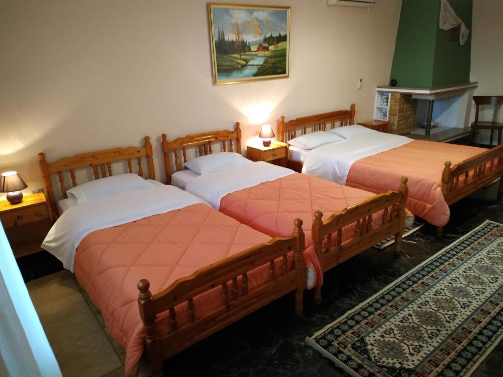Postel nebo postele na pokoji v ubytování Pension Vergina