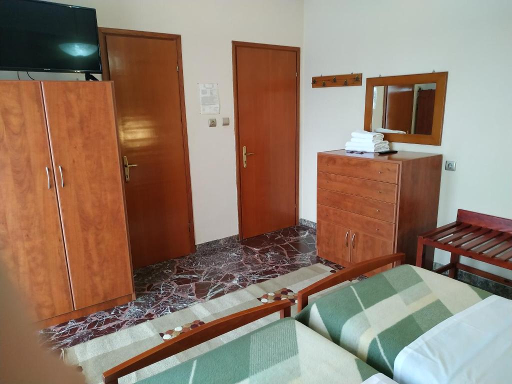 Postel nebo postele na pokoji v ubytování Pension Vergina