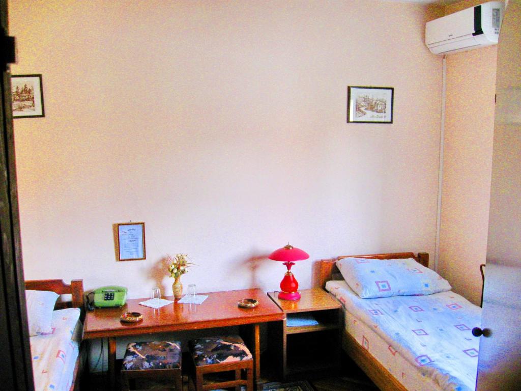 Voodi või voodid majutusasutuse Amfora Rooms Caribrod toas