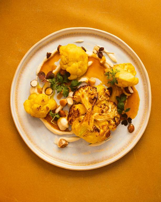 a plate of food with food on a table at Hotel Stary in Kraków
