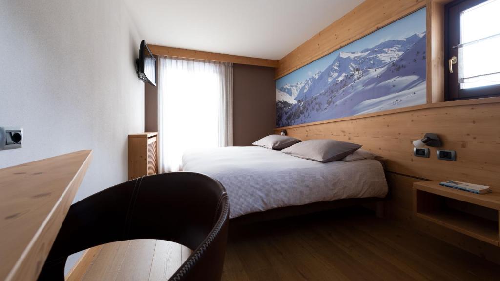 Postel nebo postele na pokoji v ubytování Hotel Compagnoni