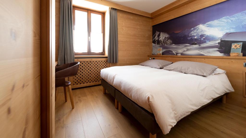 Postel nebo postele na pokoji v ubytování Hotel Compagnoni