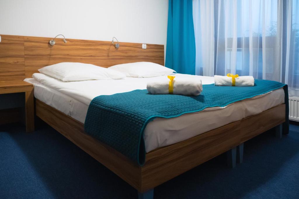 Postel nebo postele na pokoji v ubytování Dom Wczasowy Jawor