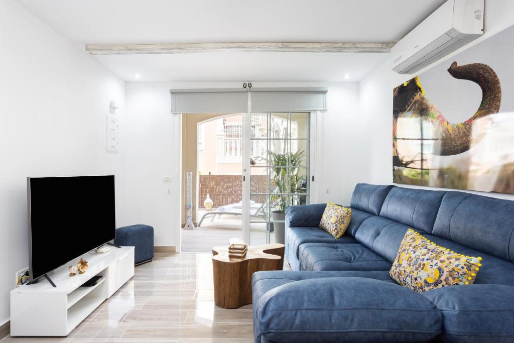 A seating area at Home2Book Palm Beach & Relax