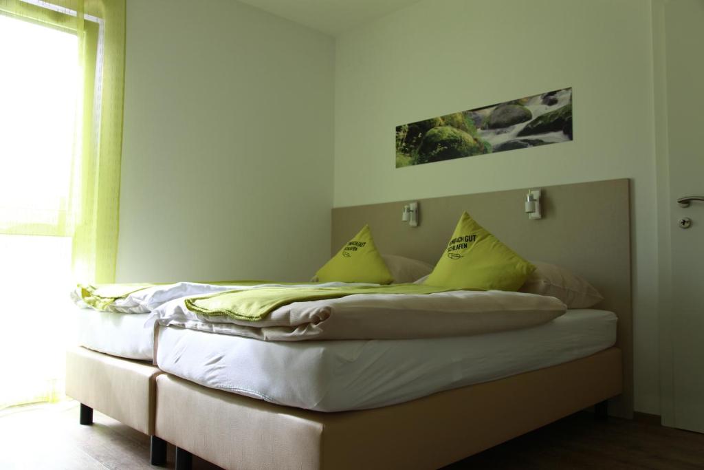 Postel nebo postele na pokoji v ubytování Smart Motel