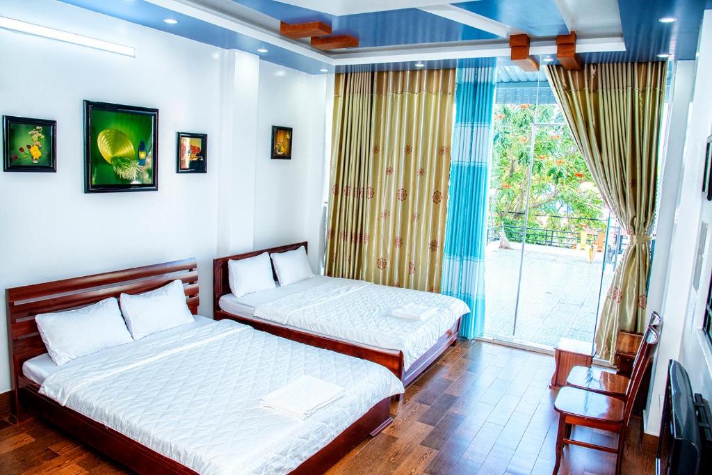 Ένα ή περισσότερα κρεβάτια σε δωμάτιο στο An Nam Corner - CanTho