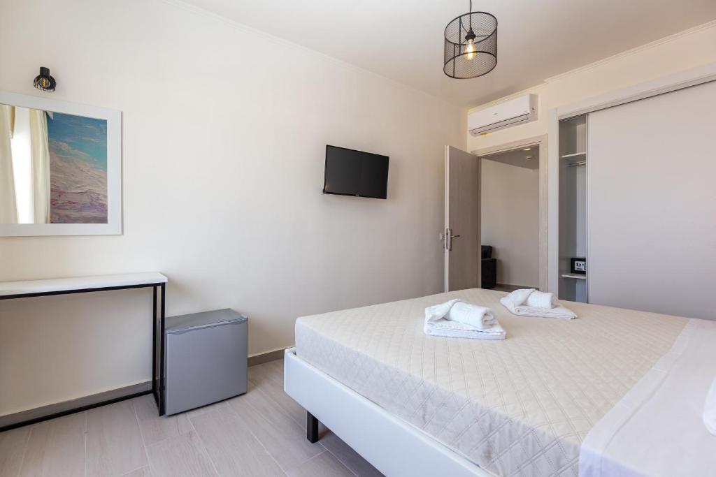 Postel nebo postele na pokoji v ubytování Aqua Luxury Suites by Estia