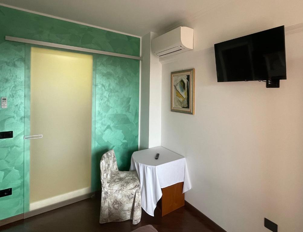Televízia a/alebo spoločenská miestnosť v ubytovaní Appartamento B&B Orizzonti