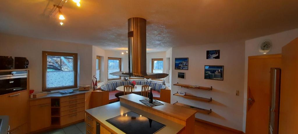 a living room with a desk and a television at Rackhof in Oberlienz