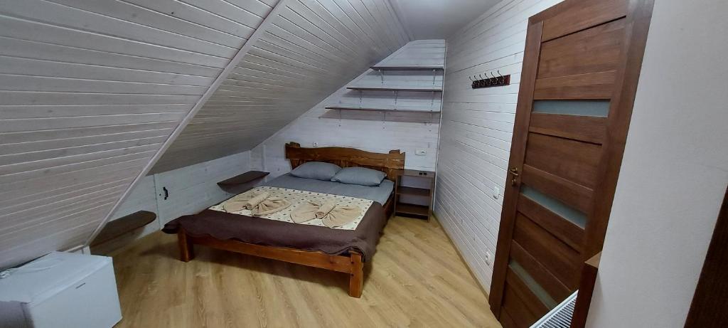 Postel nebo postele na pokoji v ubytování U Stozi Hotel