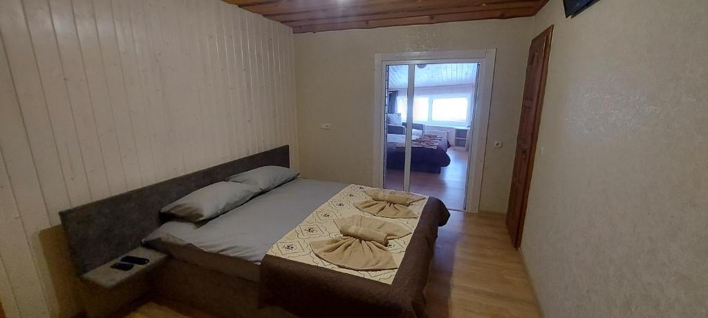 Postel nebo postele na pokoji v ubytování U Stozi Hotel