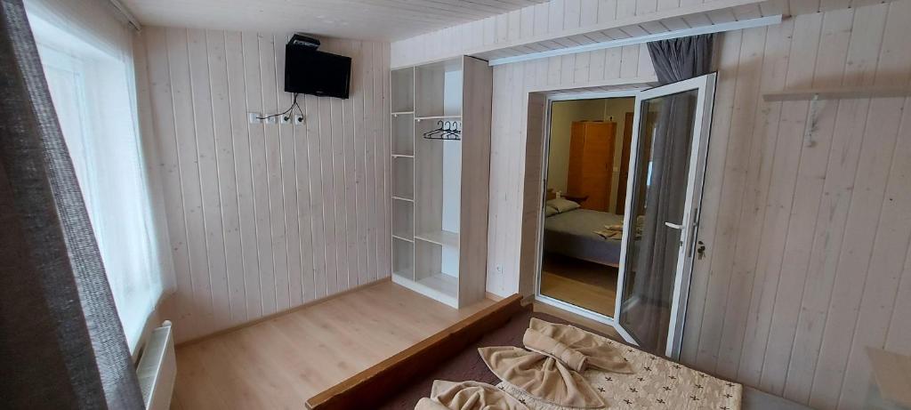 Postel nebo postele na pokoji v ubytování U Stozi Hotel