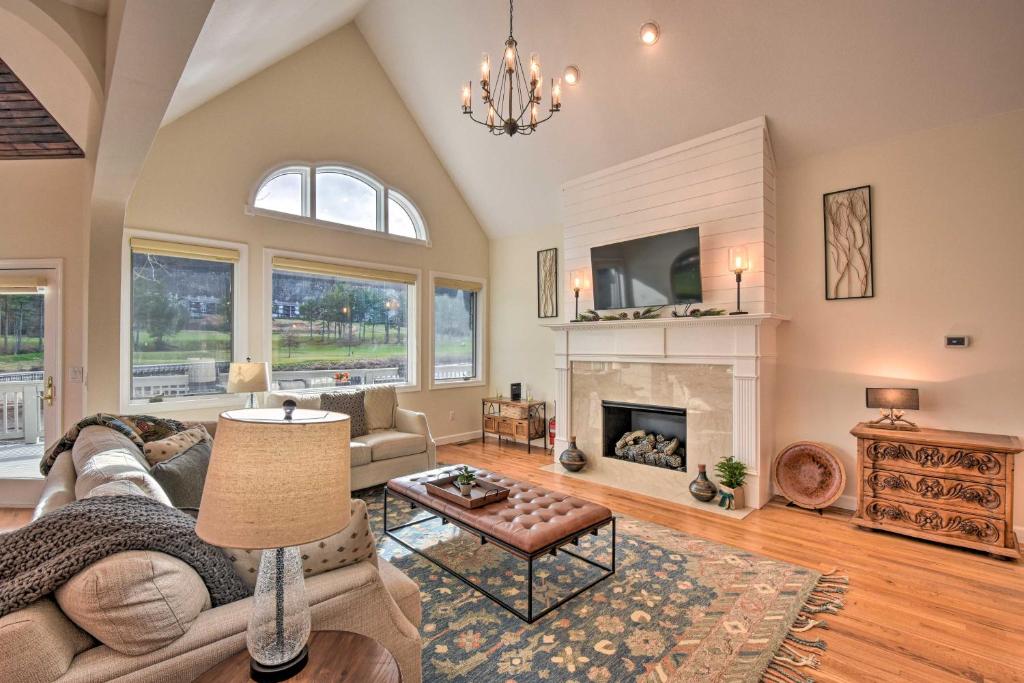 a living room with a couch and a fireplace at Chic Sky Valley Resort Home on Golf Course! in Sky Valley