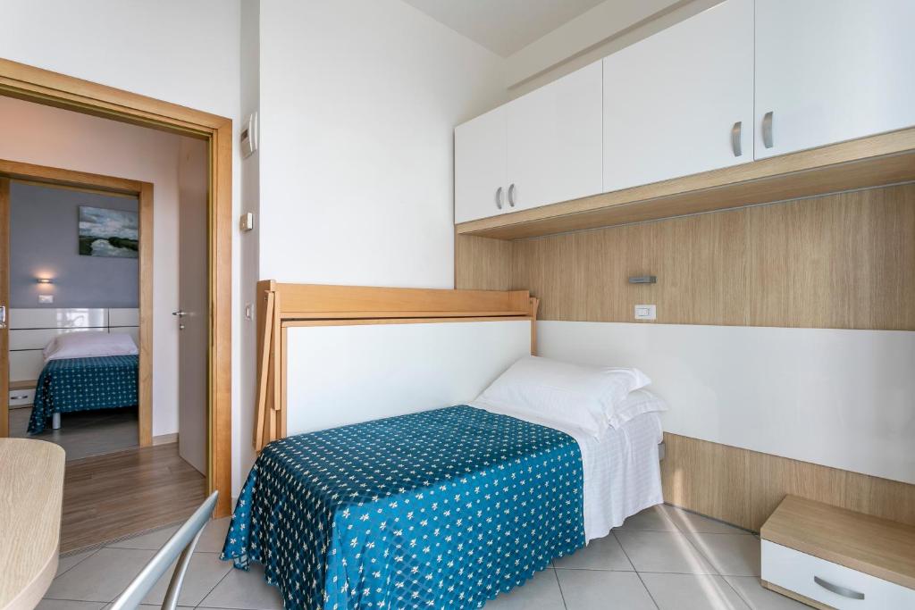 Postel nebo postele na pokoji v ubytování Hotel Baya - in centro, sul mare