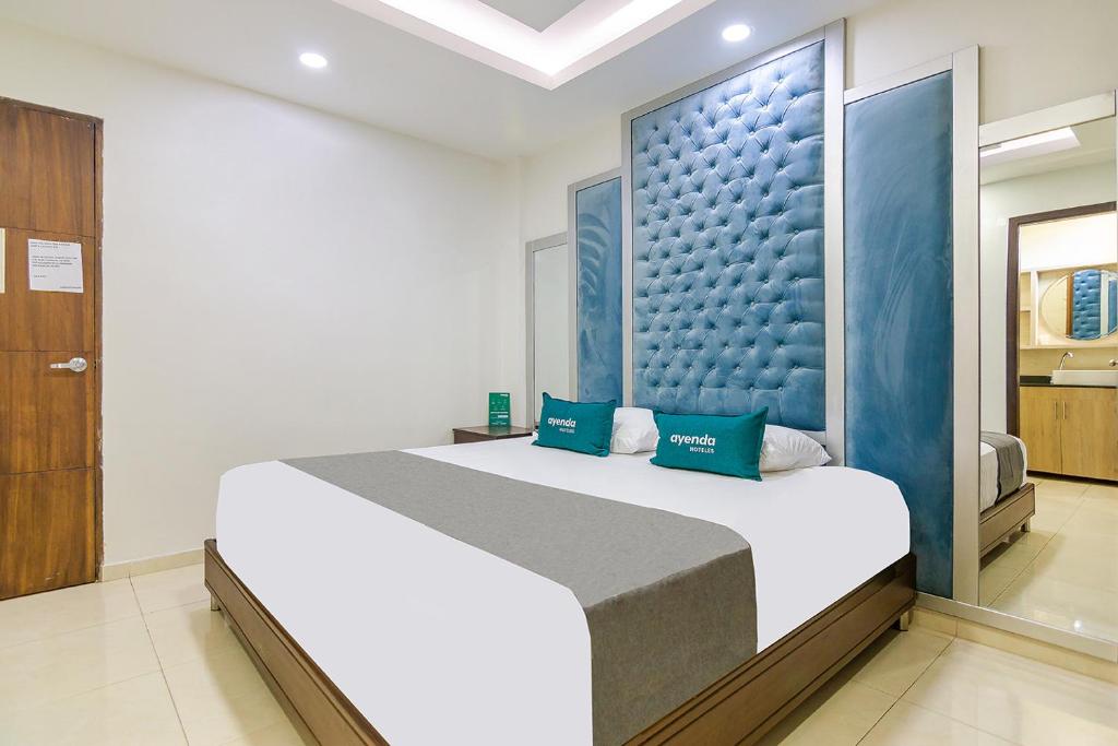Un pat sau paturi într-o cameră la Ayenda Elyamar V
