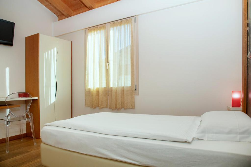 Postel nebo postele na pokoji v ubytování Via Verdi B&B