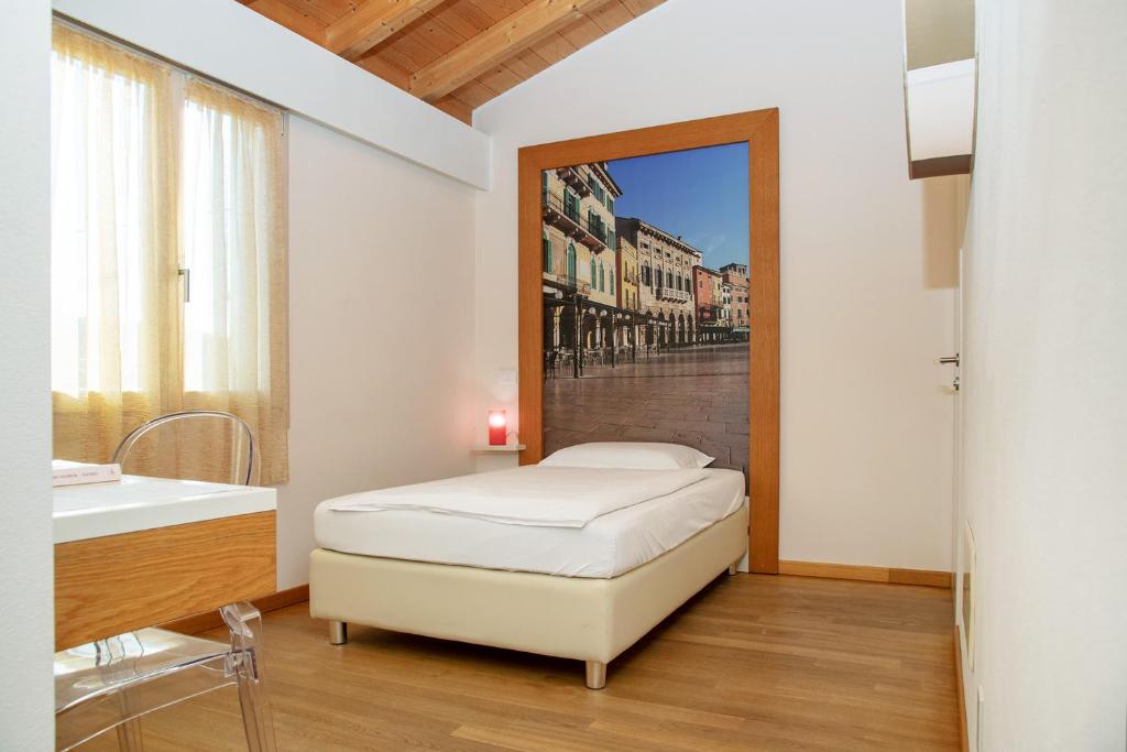Postel nebo postele na pokoji v ubytování Via Verdi B&B