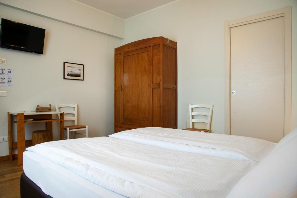 Postel nebo postele na pokoji v ubytování Via Verdi B&B