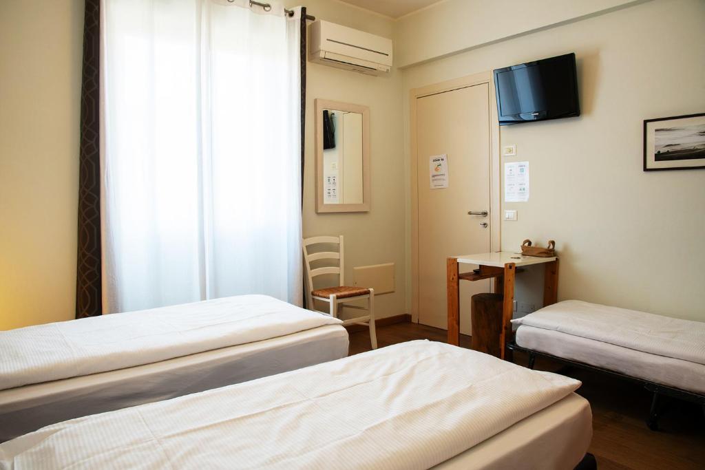 Postel nebo postele na pokoji v ubytování Via Verdi B&B