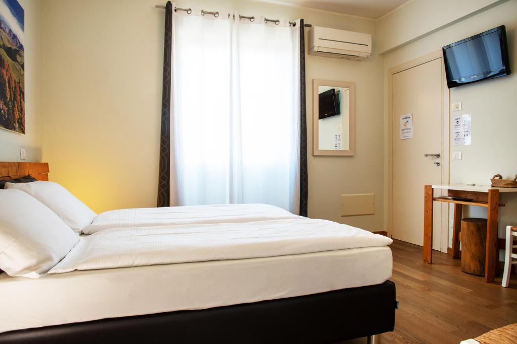 Postel nebo postele na pokoji v ubytování Via Verdi B&B