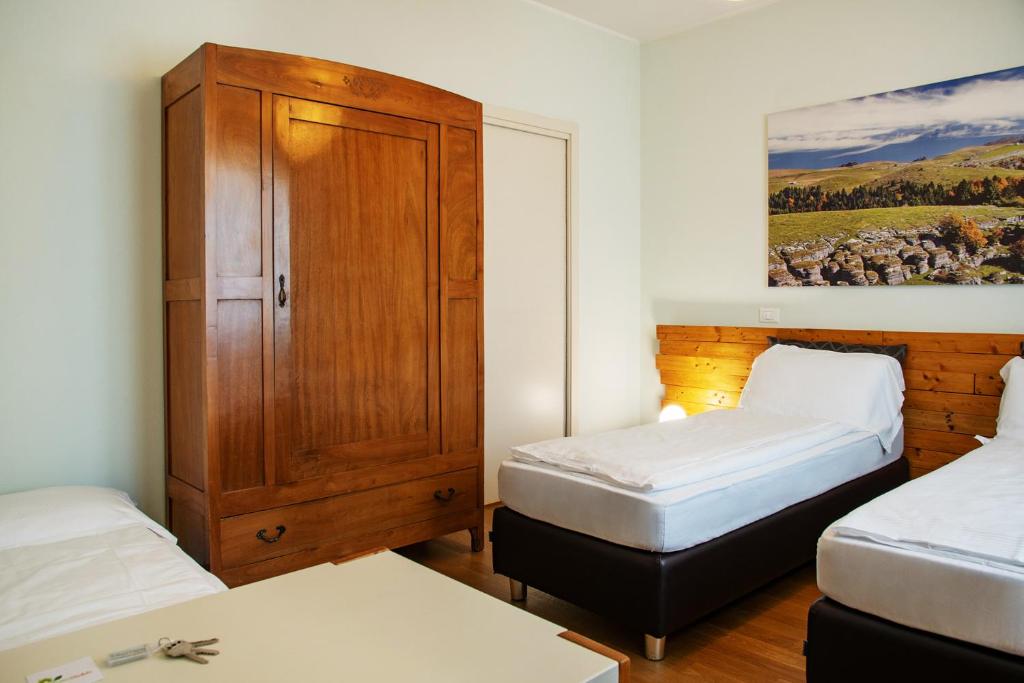 Postel nebo postele na pokoji v ubytování Via Verdi B&B
