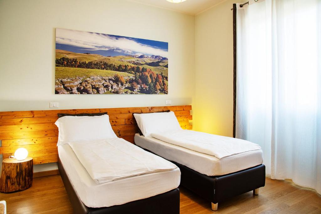 Postel nebo postele na pokoji v ubytování Via Verdi B&B