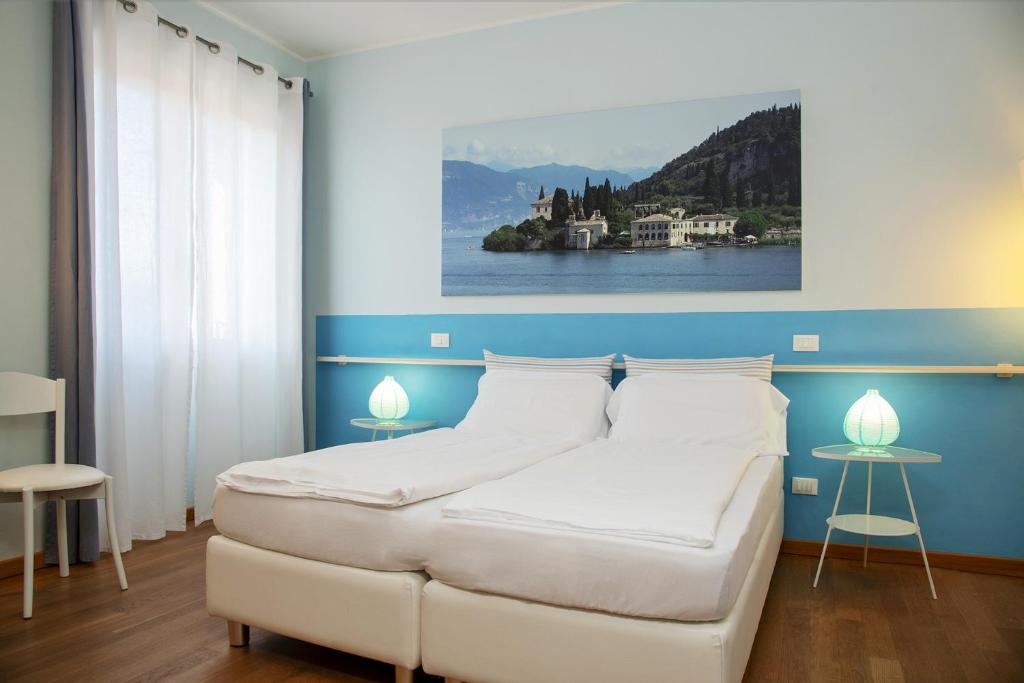 Postel nebo postele na pokoji v ubytování Via Verdi B&B