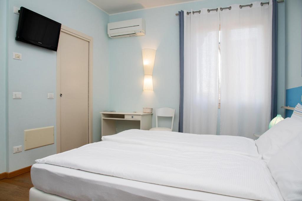 Postel nebo postele na pokoji v ubytování Via Verdi B&B