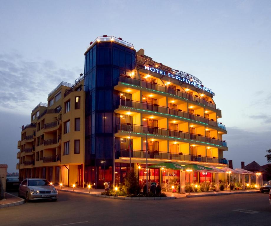 a building with a car parked in front of it at Petar and Pavel Hotel & Relax Center in Pomorie