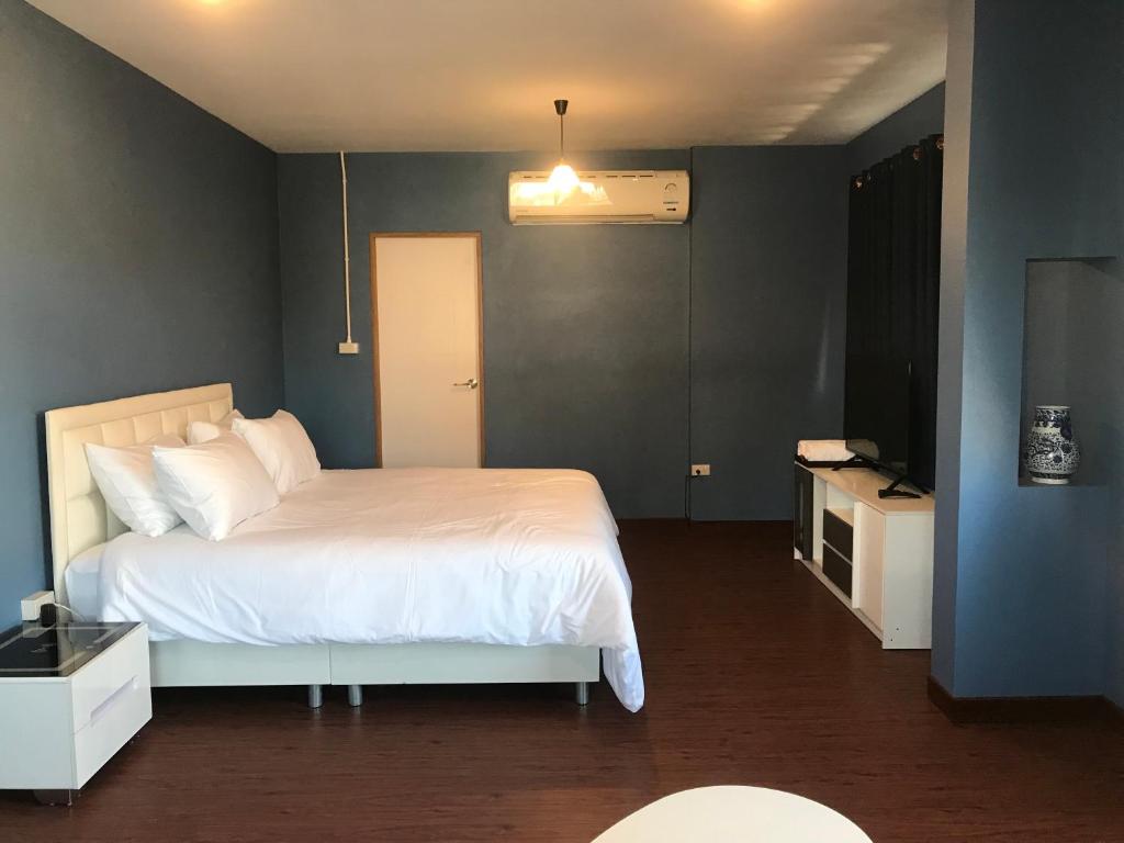 Postel nebo postele na pokoji v ubytování Benja369 บ้านเบญจา