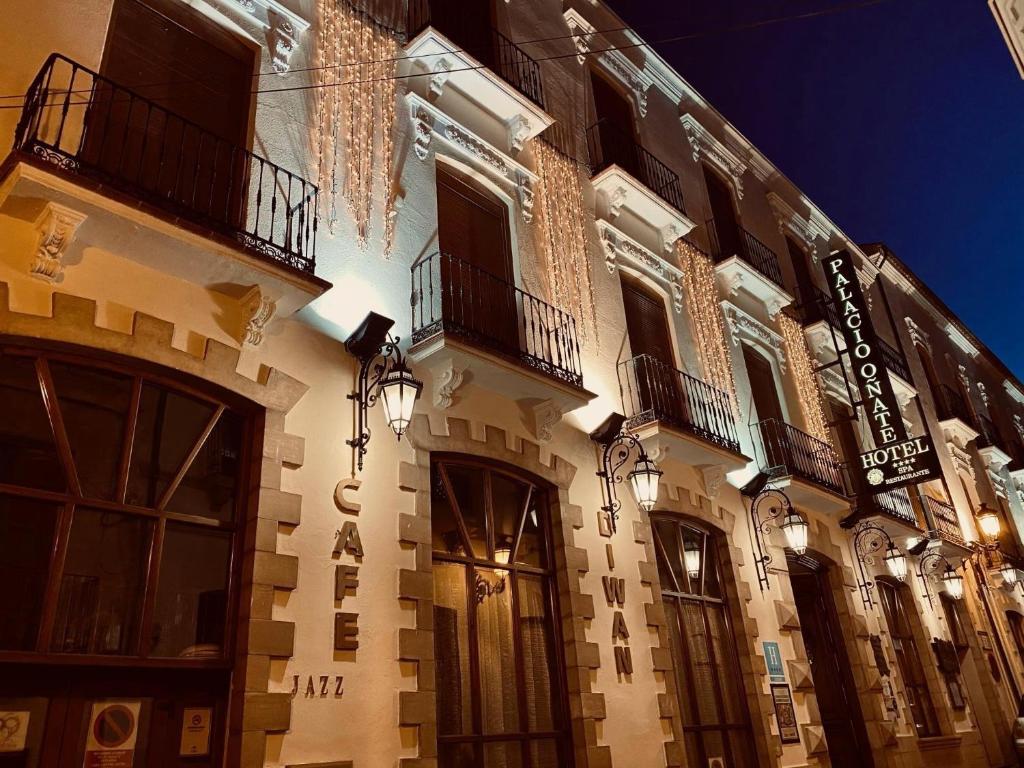 a building with balconies on the side of it at Hotel Palacio de Oñate in Guadix