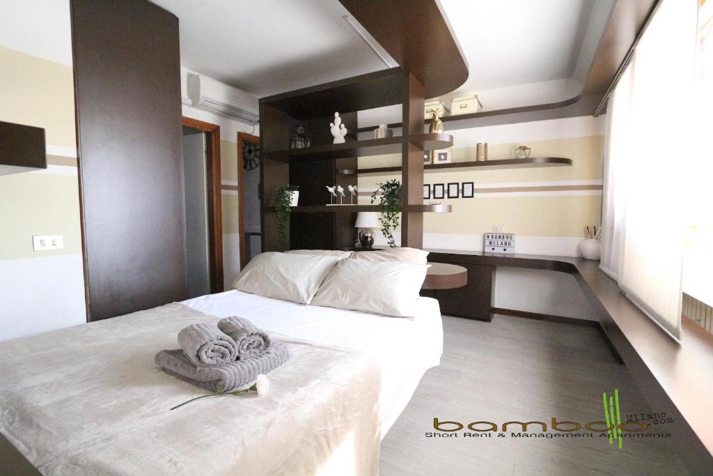 En eller flere senge i et værelse på Bamboo Milano Vico