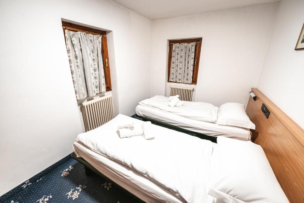 Postel nebo postele na pokoji v ubytování Smart Hotel Renzi