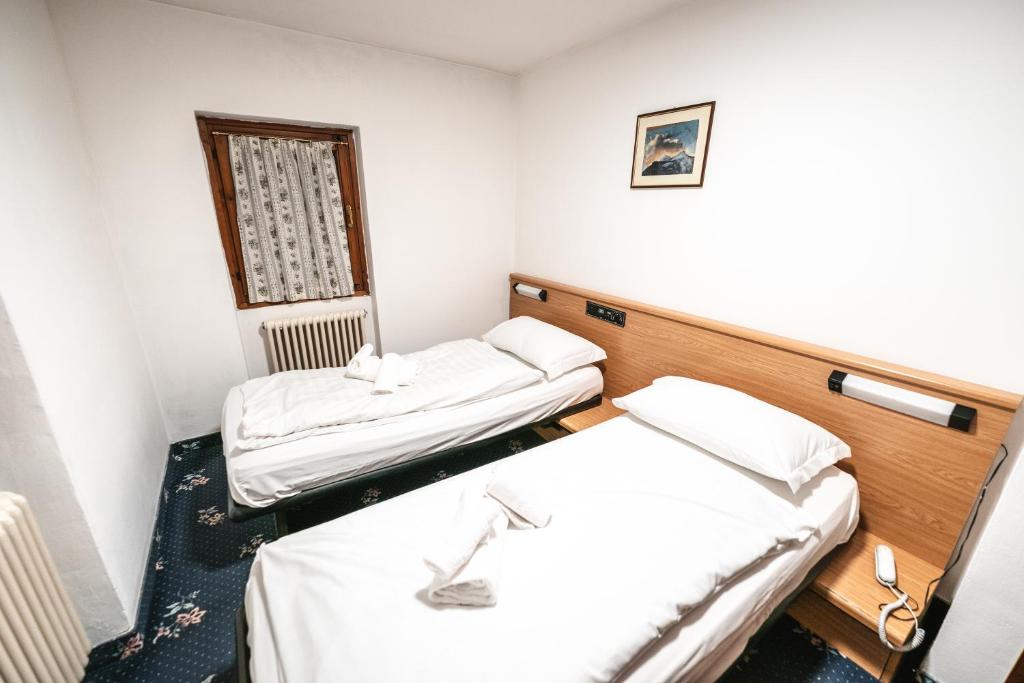 Postel nebo postele na pokoji v ubytování Smart Hotel Renzi
