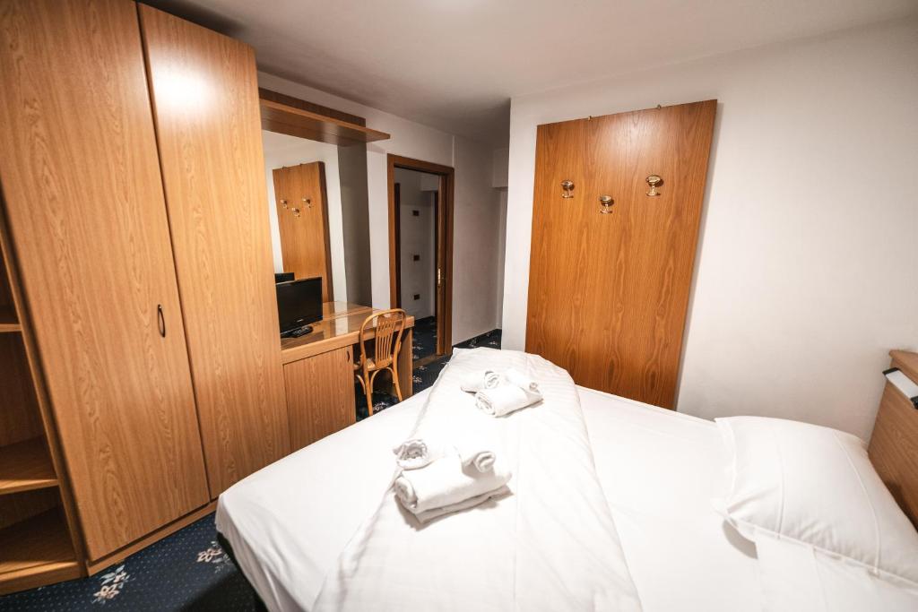 Postel nebo postele na pokoji v ubytování Smart Hotel Renzi
