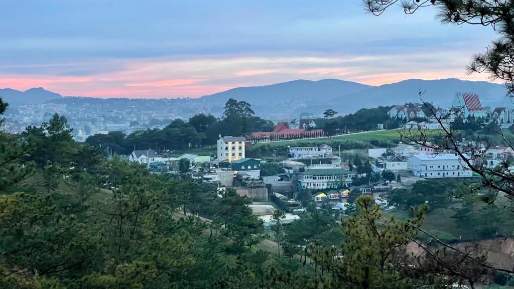 a view of a town with mountains in the background at Villa Délight House “Stay&Chill” in Da Lat