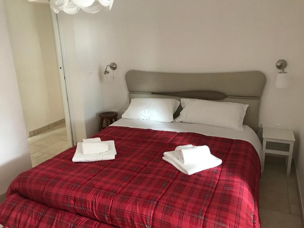 Posteľ alebo postele v izbe v ubytovaní I trulli di nonno Ernesto