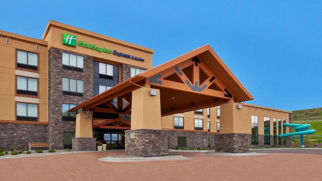 a rendering of a hotel building with a slide at Holiday Inn Express and Suites Great Falls, an IHG Hotel in Great Falls