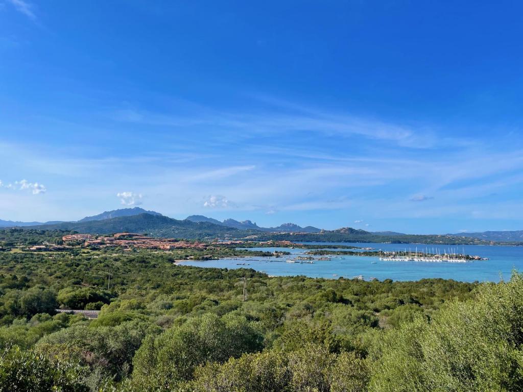 a view of a lake with boats in the water at Casa Leo - Villaggio Baia De Bahas in Golfo Aranci