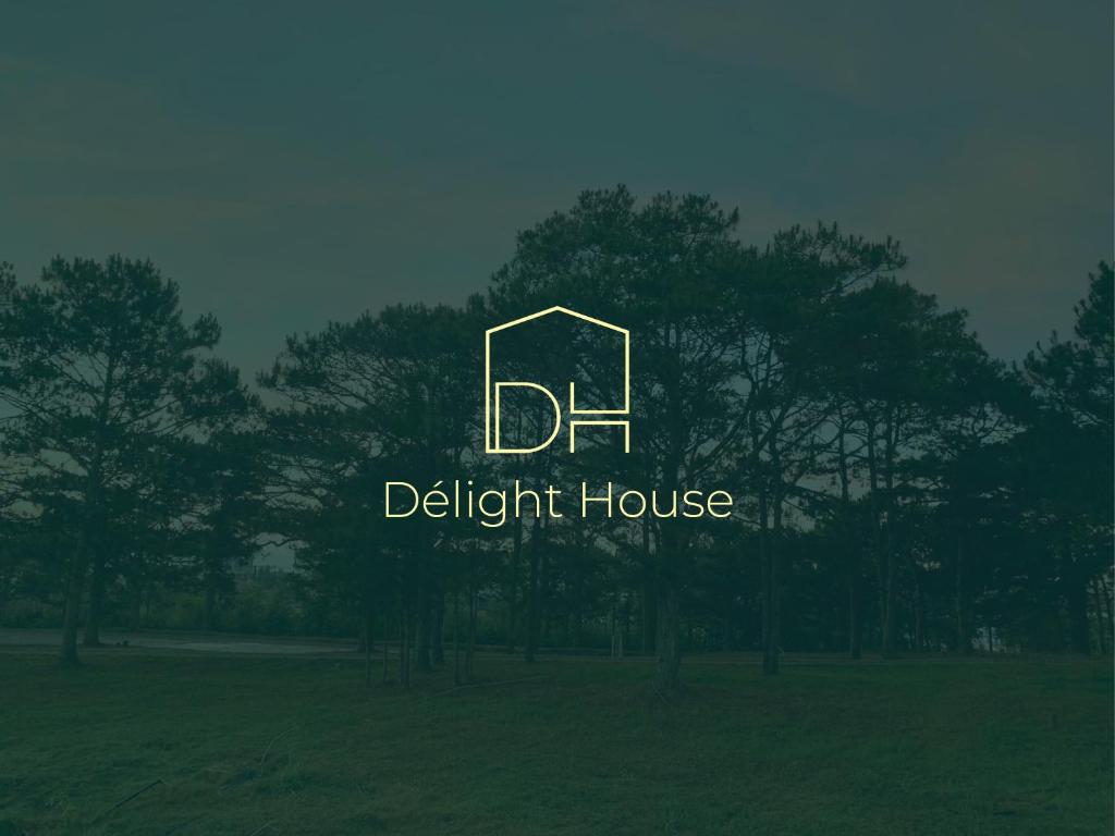 a logo for a light house in a field at Villa Délight House “Stay&Chill” in Da Lat