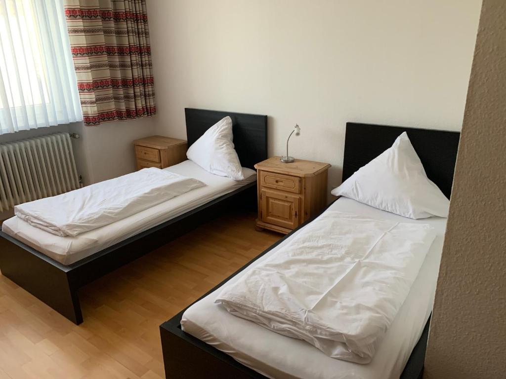 Ein Bett oder Betten in einem Zimmer der Unterkunft Landgasthaus Klosterhof